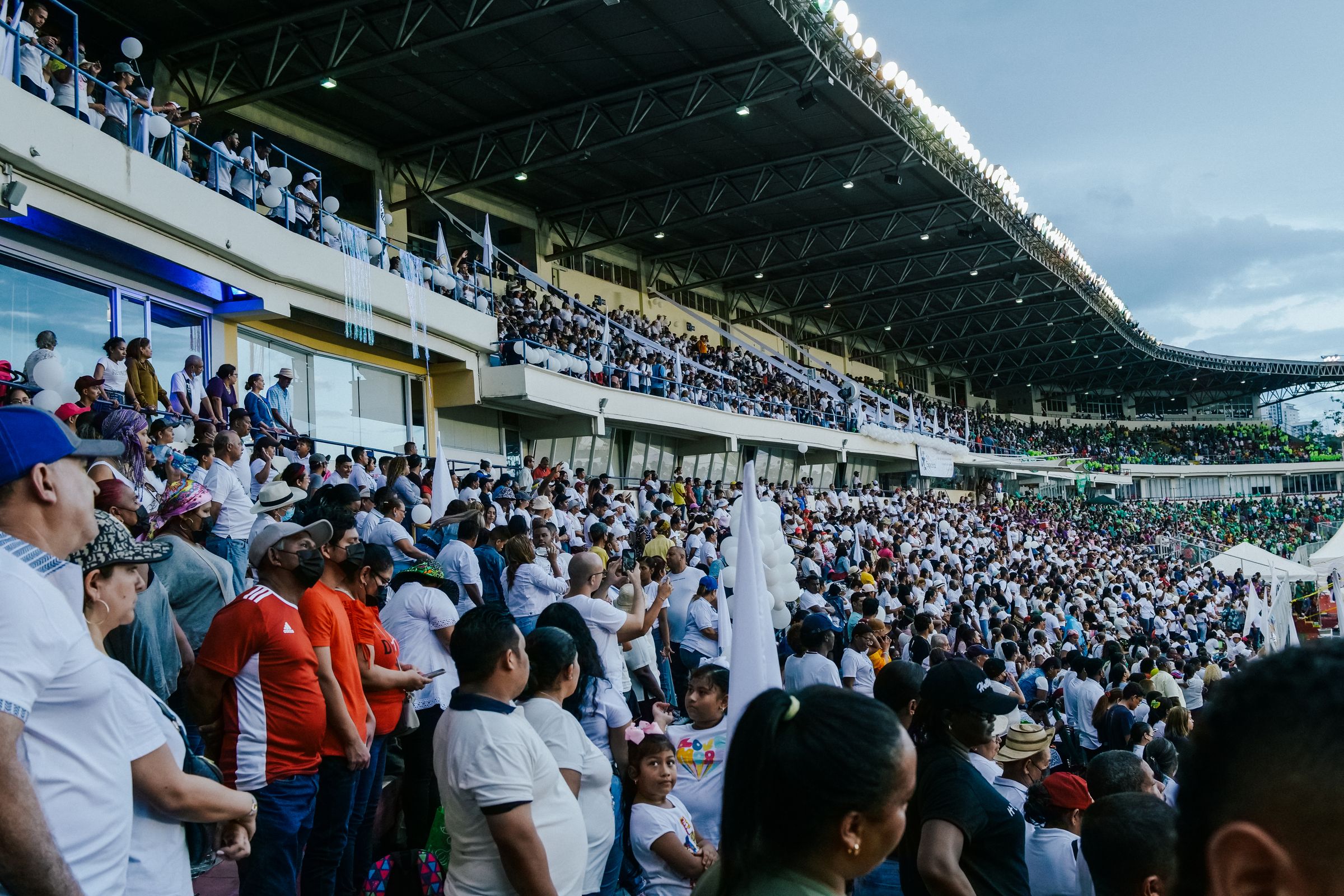 A diverse crowd taking part in a live stadium experience