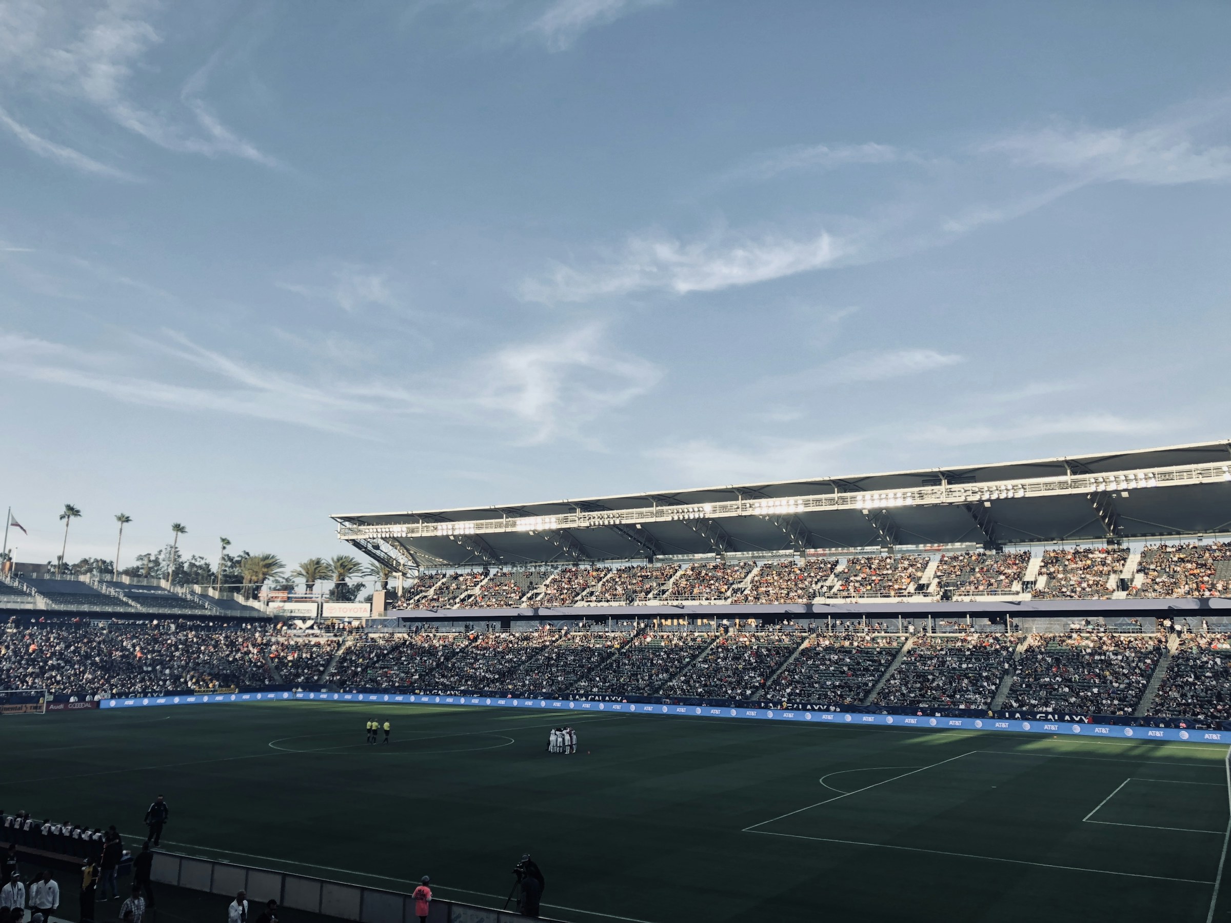 A soccer match and full grandstand at a stadium in Carson, California