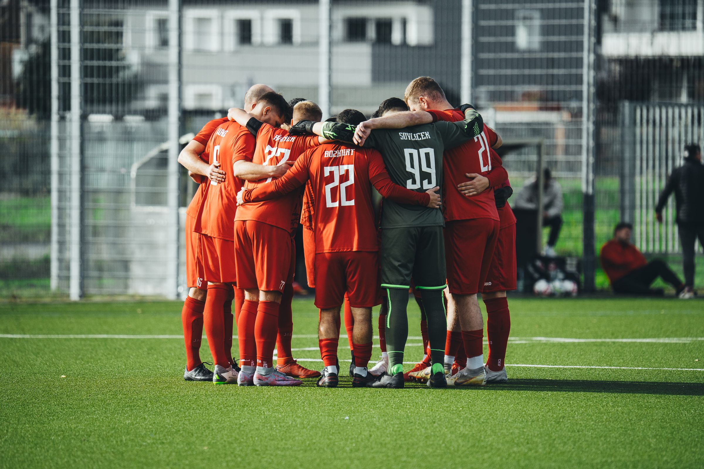 Soccer team huddling before a match